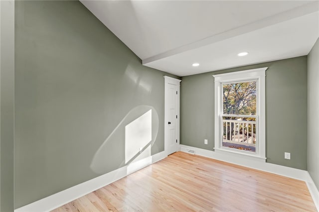 unfurnished room featuring light wood-type flooring