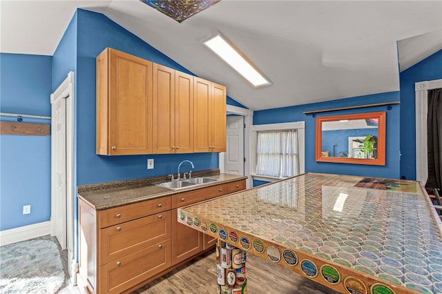 101 Fieldbrook Dr, Peters Twp, PA 15317 - kitchen with lofted ceiling, a sink, light wood finished floors, and dark countertops