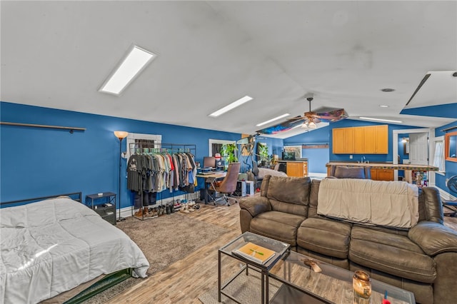 bedroom featuring lofted ceiling, hardwood / wood-style floors, and ceiling fan