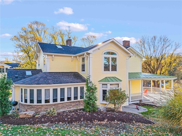101 Fieldbrook Dr, Peters Twp, PA 15317 - back of property with a porch, a chimney, stone siding, and a standing seam roof