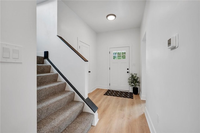 entryway with hardwood / wood-style floors