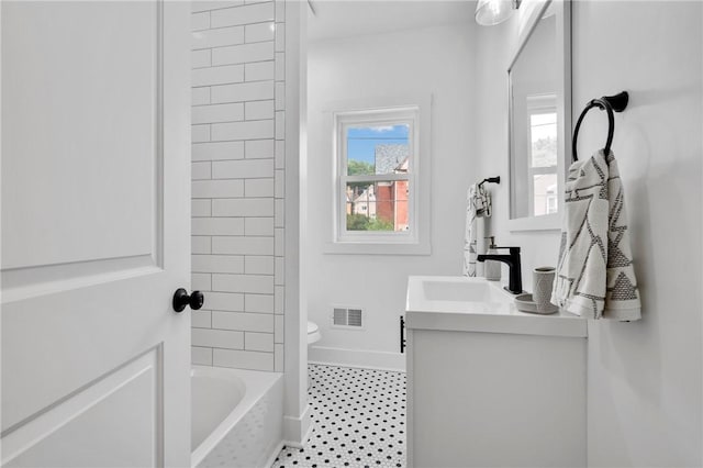 full bathroom with vanity, shower / tub combination, and toilet