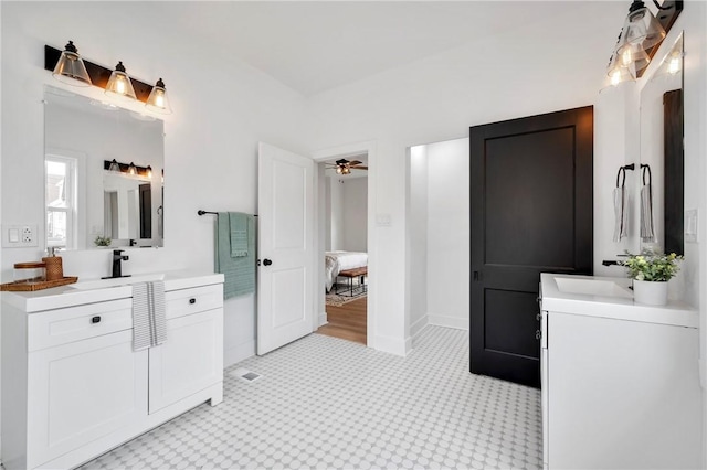 bathroom with ceiling fan, vanity, and tile patterned flooring