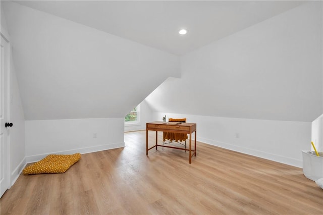 bonus room with vaulted ceiling and light hardwood / wood-style floors