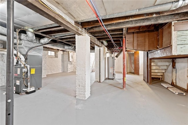 basement featuring heating unit and gas water heater