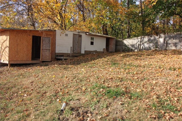 back of house with a yard