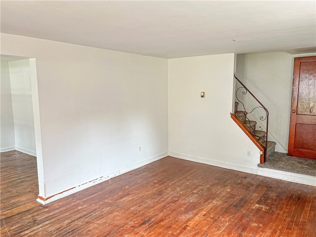 unfurnished room with hardwood / wood-style flooring