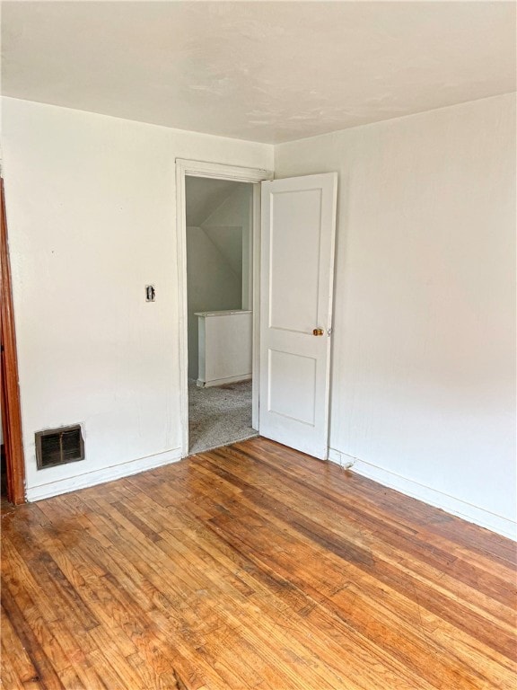 spare room with light hardwood / wood-style flooring