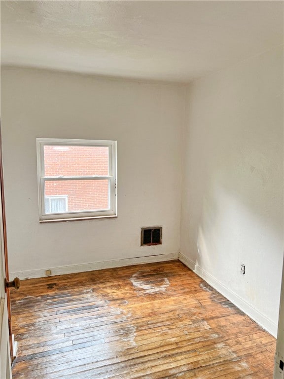 spare room with light wood-type flooring