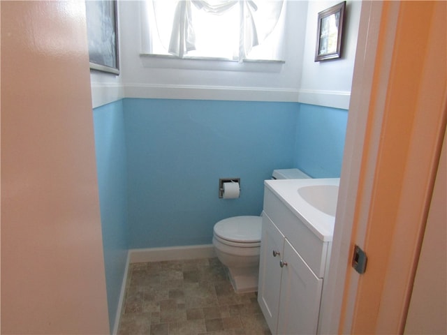 bathroom with toilet and vanity