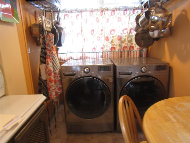 washroom featuring washer and dryer, plenty of natural light, and tile patterned floors