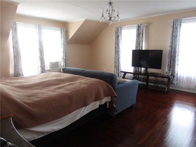 bedroom featuring dark wood-type flooring, multiple windows, and an inviting chandelier