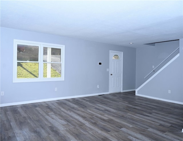 unfurnished room featuring dark hardwood / wood-style flooring