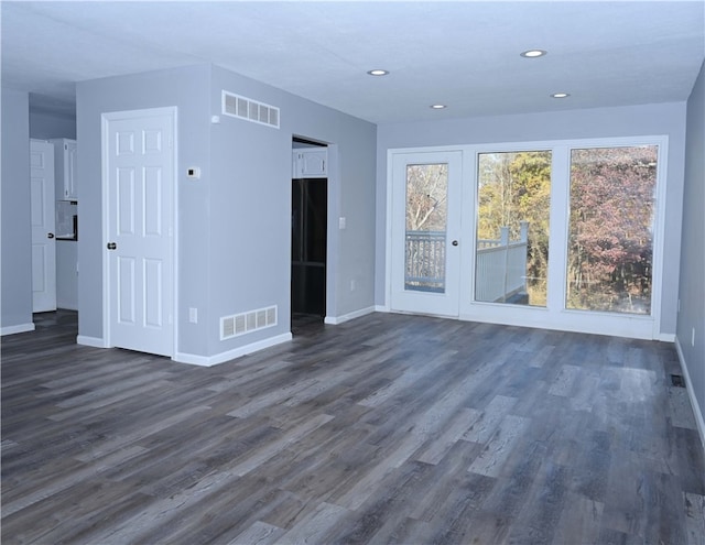 unfurnished room featuring dark hardwood / wood-style flooring