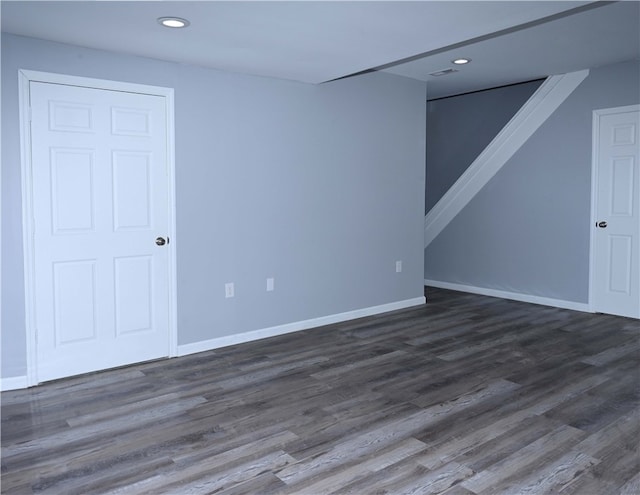 spare room featuring dark hardwood / wood-style flooring