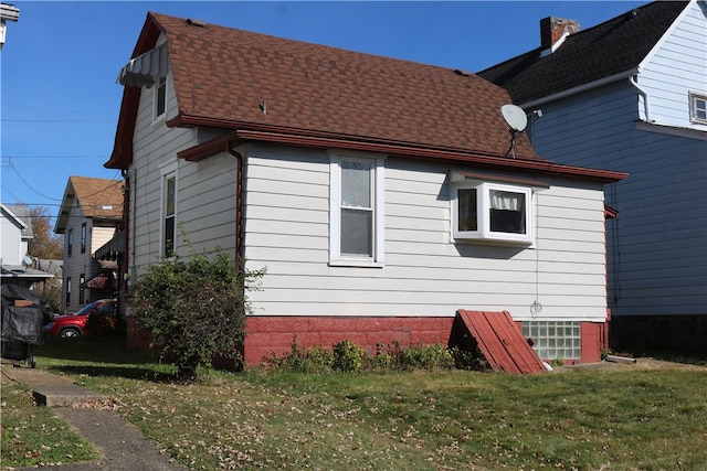 view of home's exterior featuring a yard