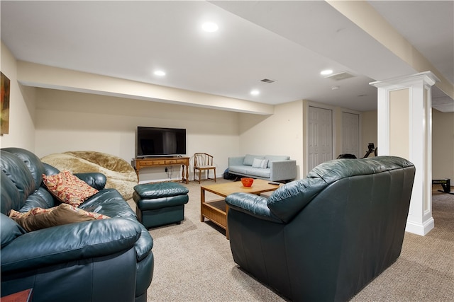 living room featuring decorative columns and carpet flooring