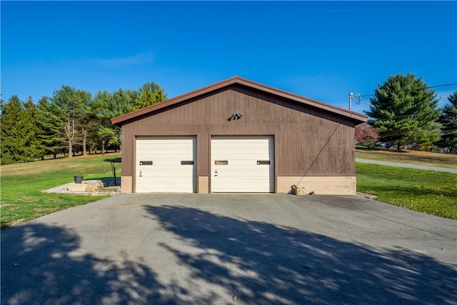 garage with a yard