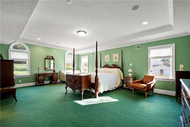 bedroom featuring carpet flooring, crown molding, and a tray ceiling