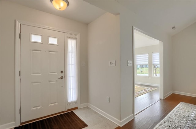 foyer entrance with light hardwood / wood-style flooring