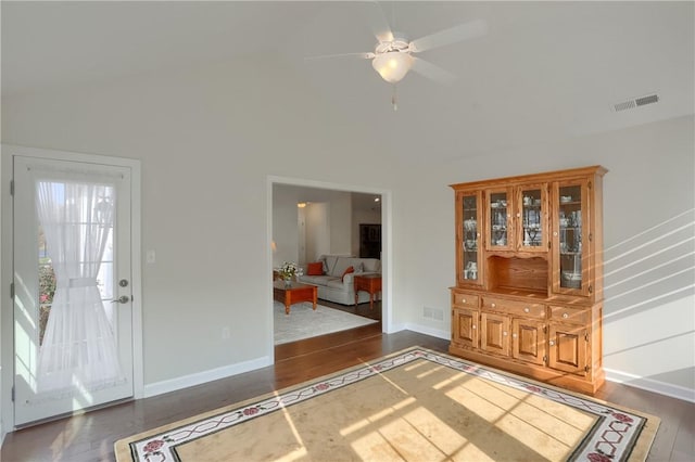 foyer with dark hardwood / wood-style floors and ceiling fan