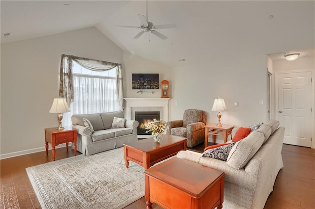 living room with dark hardwood / wood-style flooring, vaulted ceiling, and ceiling fan