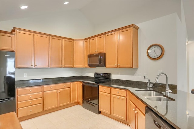 kitchen with dark stone countertops, sink, black appliances, and vaulted ceiling