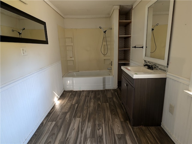 bathroom featuring hardwood / wood-style floors, vanity, crown molding, and tub / shower combination