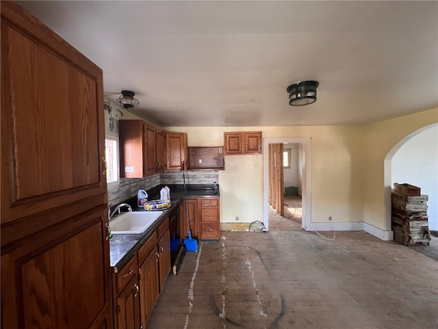 kitchen with tasteful backsplash and sink