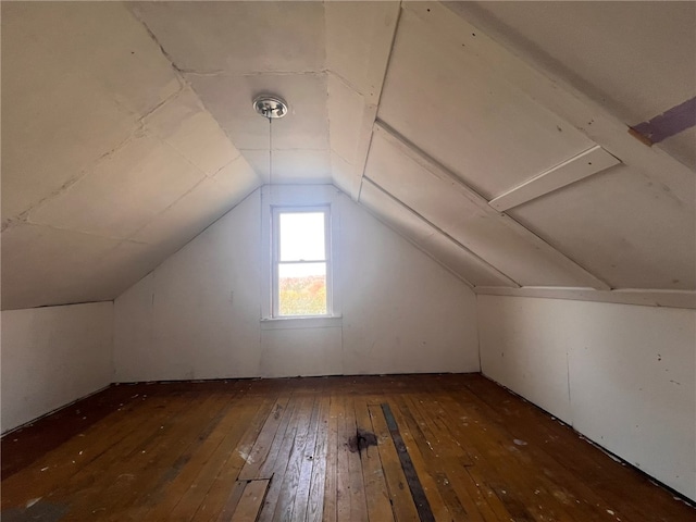 bonus room featuring dark hardwood / wood-style floors and lofted ceiling