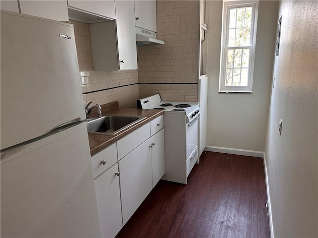 5900 Babcock Blvd Unit 80, Ross Twp, PA 15237 - kitchen with white appliances, a sink, dark wood-style floors, decorative backsplash, and white cabinetry