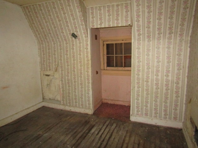 unfurnished room featuring dark wood-type flooring