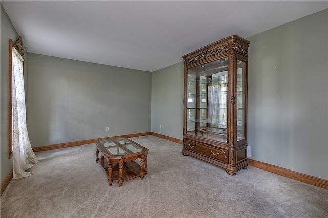 unfurnished room with light colored carpet