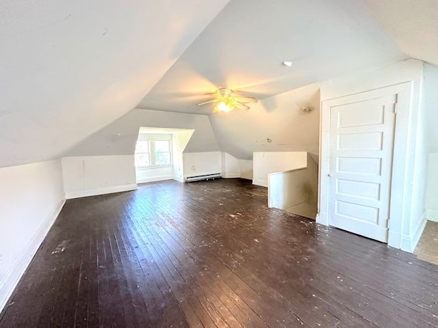 bonus room with dark wood-type flooring, vaulted ceiling, ceiling fan, and a baseboard radiator