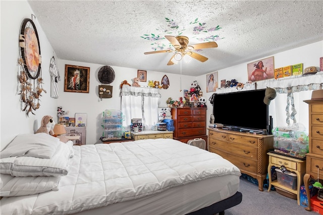 bedroom featuring a textured ceiling, carpet floors, and ceiling fan