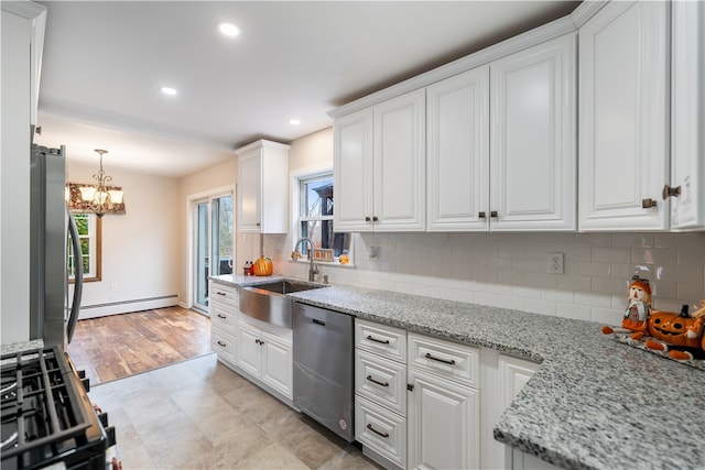 kitchen featuring stainless steel appliances, white cabinetry, sink, a baseboard heating unit, and light wood-type flooring