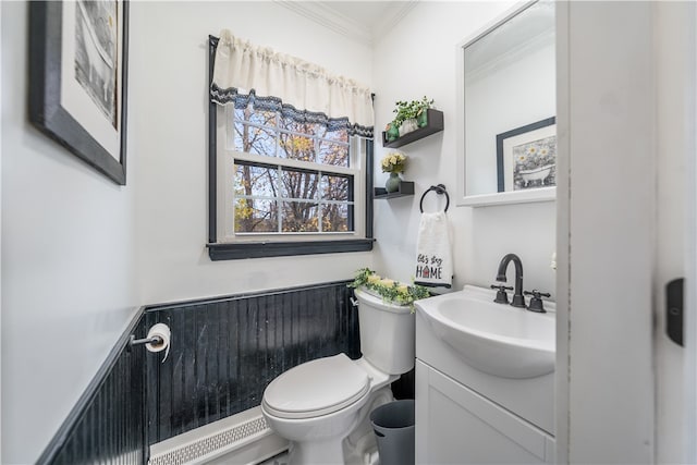 bathroom featuring crown molding, vanity, and toilet