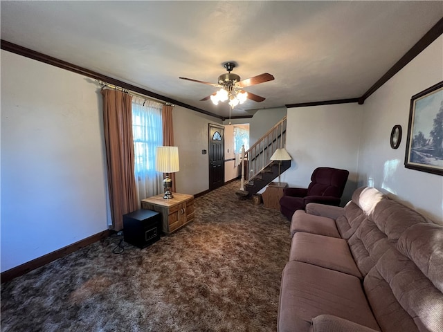 living room featuring ornamental molding, dark colored carpet, and ceiling fan