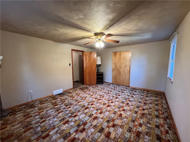 unfurnished bedroom with ceiling fan