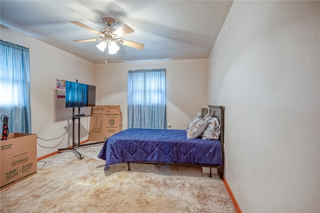 bedroom with ceiling fan and carpet