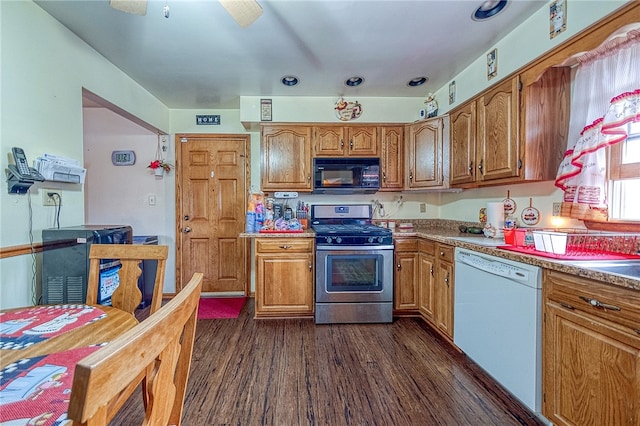 kitchen featuring stainless steel gas stove, dark hardwood / wood-style floors, dishwasher, and ceiling fan