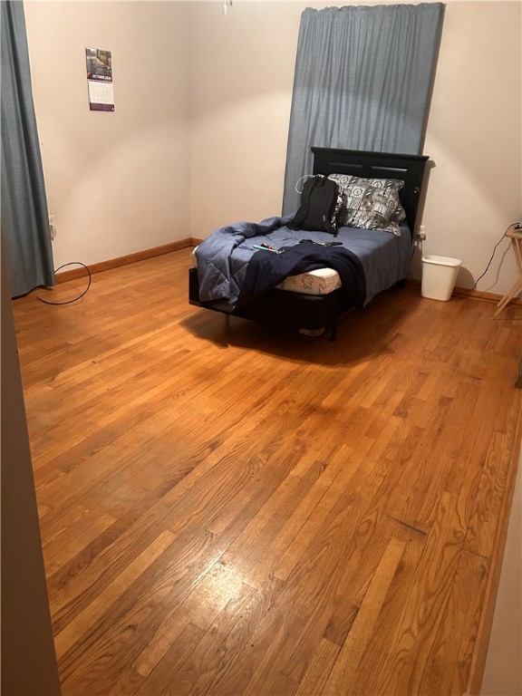 bedroom with light wood-type flooring