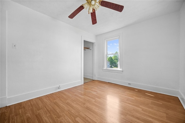 unfurnished room with ceiling fan and light hardwood / wood-style flooring