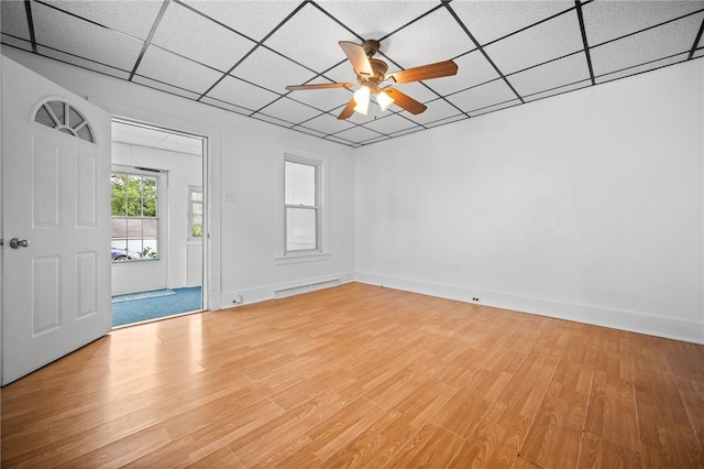 entrance foyer featuring a paneled ceiling, wood-type flooring, ceiling fan, and a baseboard heating unit