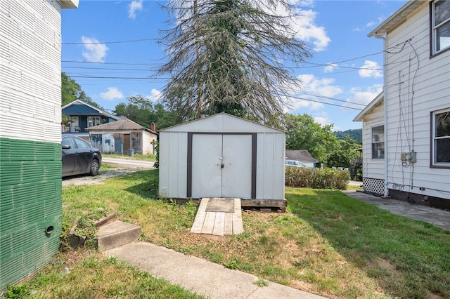 view of outdoor structure featuring a yard