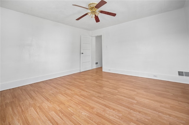 unfurnished room with ceiling fan and light wood-type flooring