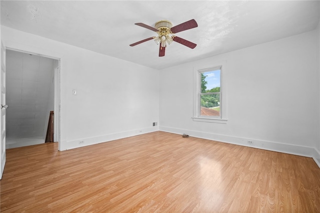 unfurnished room with light hardwood / wood-style flooring and ceiling fan