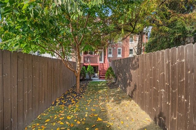 view of yard featuring a wooden deck