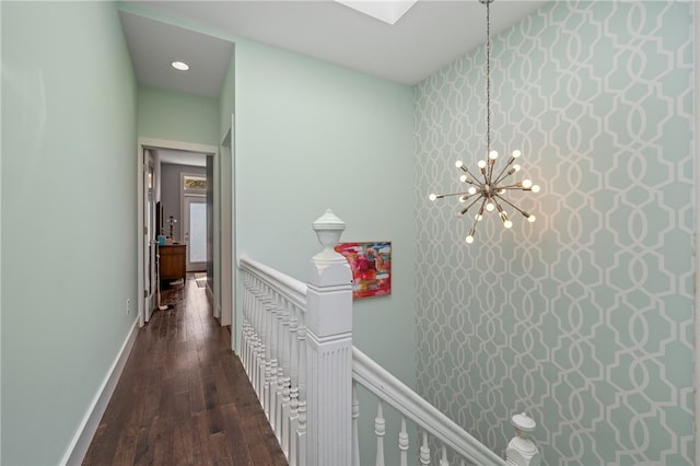 corridor with dark hardwood / wood-style flooring