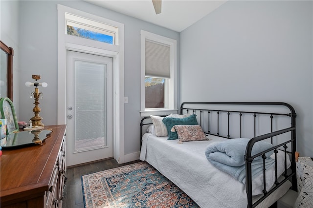 bedroom with dark wood-type flooring, ceiling fan, and sink